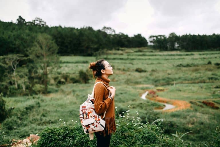 A female hiking on one of her reset trips for mental health.