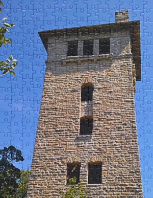 Water tower jigsaw puzzle featuring an old stone water tower.